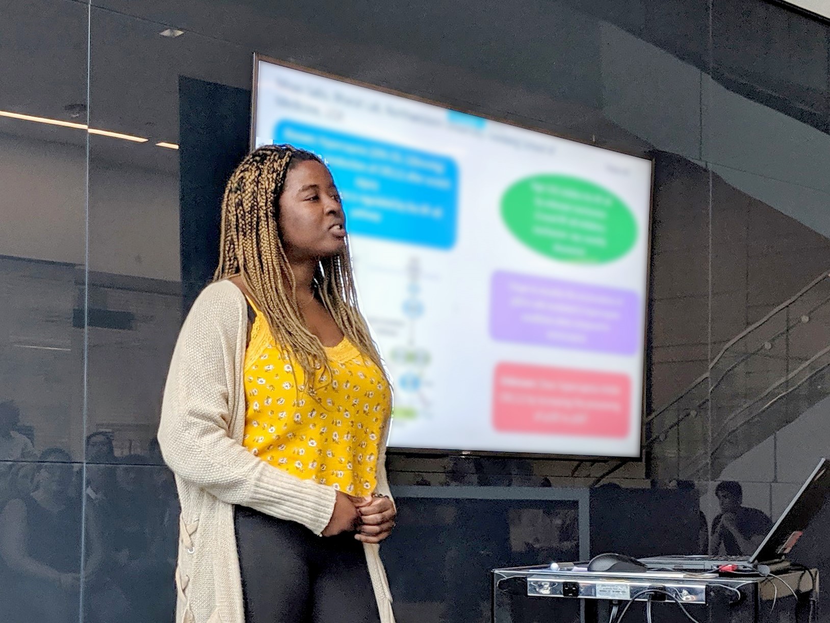 An intern gives her "RAPid" oral presentation at the Summer Research Symposium